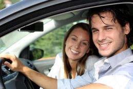 Portrait happy, smiling woman sitting in the car looking out windows.jpg