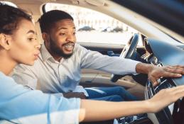 Portrait happy, smiling woman sitting in the car looking out windows.jpg