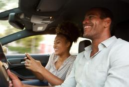 Portrait happy, smiling woman sitting in the car looking out windows.jpg