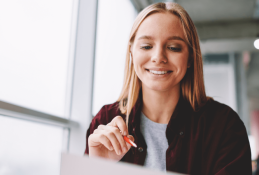 Portrait happy, smiling woman sitting in the car looking out windows.jpg