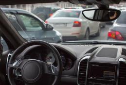 Portrait happy, smiling woman sitting in the car looking out windows.jpg