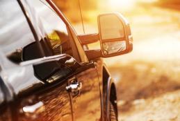 Portrait happy, smiling woman sitting in the car looking out windows.jpg