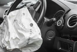 Portrait happy, smiling woman sitting in the car looking out windows.jpg