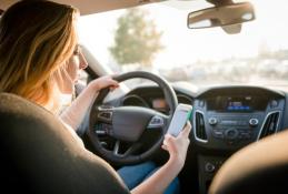 Portrait happy, smiling woman sitting in the car looking out windows.jpg