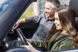 Portrait happy, smiling woman sitting in the car looking out windows.jpg