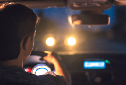 Portrait happy, smiling woman sitting in the car looking out windows.jpg