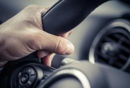 Portrait happy, smiling woman sitting in the car looking out windows.jpg