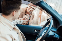 Portrait happy, smiling woman sitting in the car looking out windows.jpg