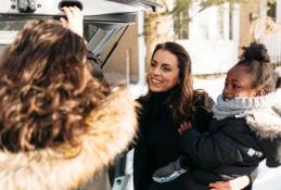 Portrait happy, smiling woman sitting in the car looking out windows.jpg