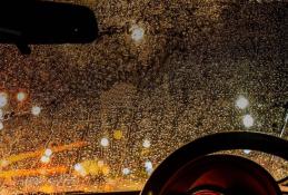 Portrait happy, smiling woman sitting in the car looking out windows.jpg