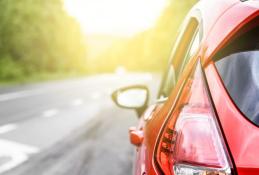 Portrait happy, smiling woman sitting in the car looking out windows.jpg