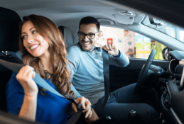 Portrait happy, smiling woman sitting in the car looking out windows.jpg