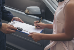 Portrait happy, smiling woman sitting in the car looking out windows.jpg