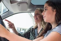 Portrait happy, smiling woman sitting in the car looking out windows.jpg