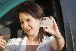 Portrait happy, smiling woman sitting in the car looking out windows.jpg