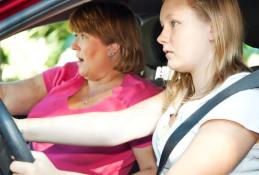 Portrait happy, smiling woman sitting in the car looking out windows.jpg