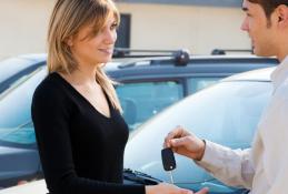 Portrait happy, smiling woman sitting in the car looking out windows.jpg