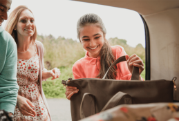 Portrait happy, smiling woman sitting in the car looking out windows.jpg