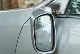 Portrait happy, smiling woman sitting in the car looking out windows.jpg