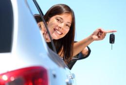 Portrait happy, smiling woman sitting in the car looking out windows.jpg